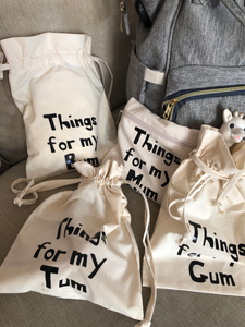 A set of canvas bags which read, Things for my Mum, things for my gum, things for my tum and things for my bum.