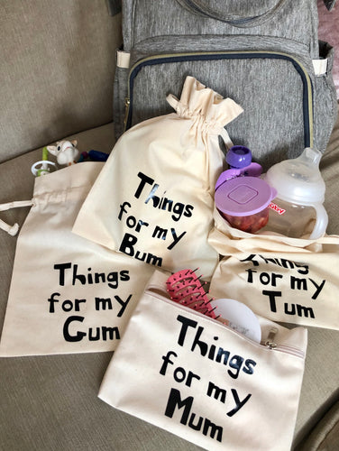 A set of canvas bags which read, Things for my Mum, things for my gum, things for my tum and things for my bum.